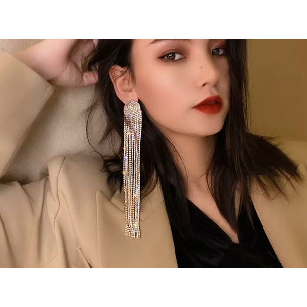 Beautiful earrings and a smile will help you sparkle and shine on stage. The delicate details of these tassel inspired earrings are perfect for any competition. These earrings will bring a touch of relaxed femininity to your suit and add a pop of sass to any outfit. 